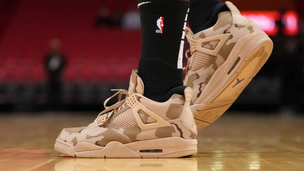 Miami Heat forward P.J. Tucker wears the Air Jordan 4 'Camo' sneakers against the New Orleans Pelicans on November 17, 2021.